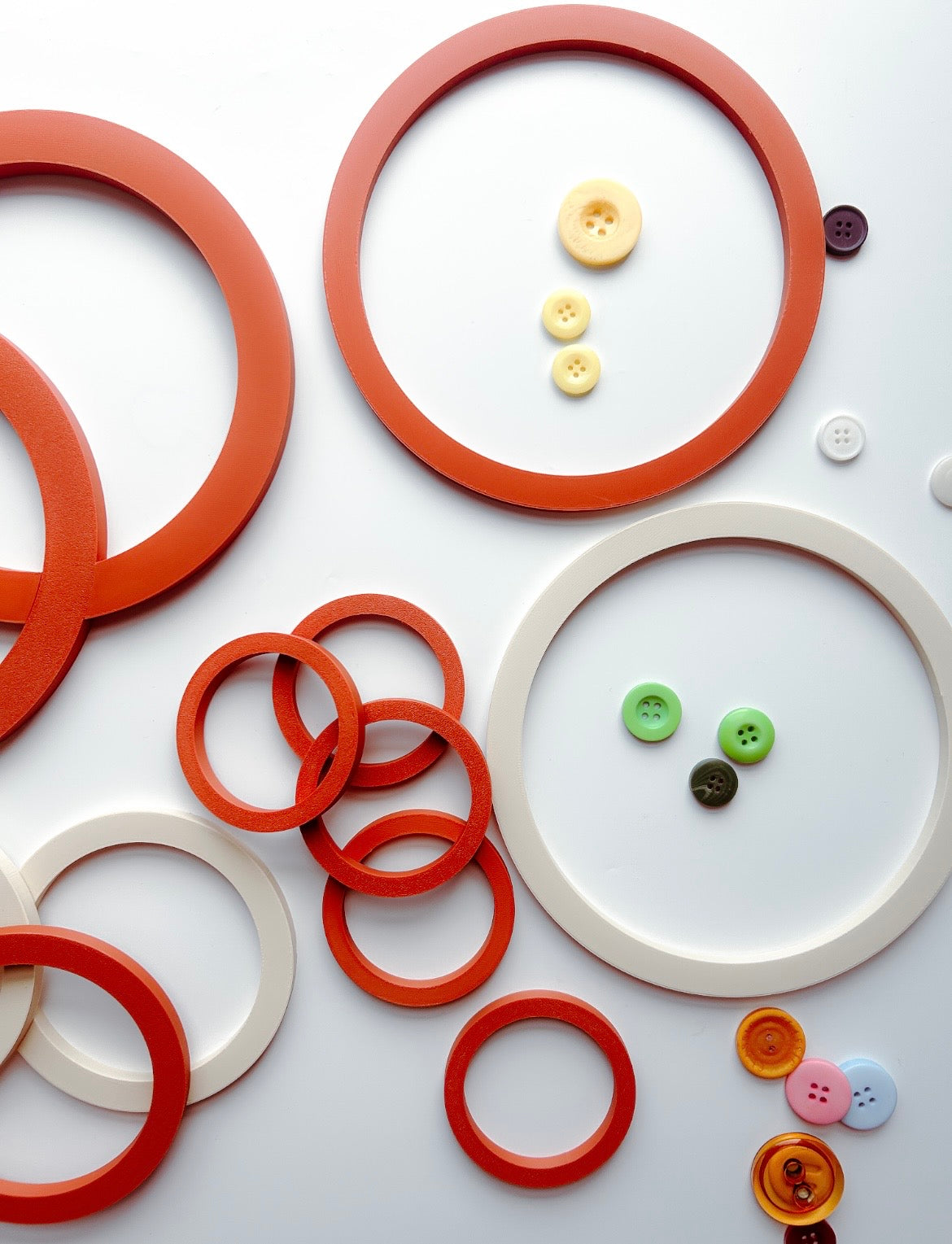Terracotta and cream Learning Circles in different sizes with buttons sorted inside