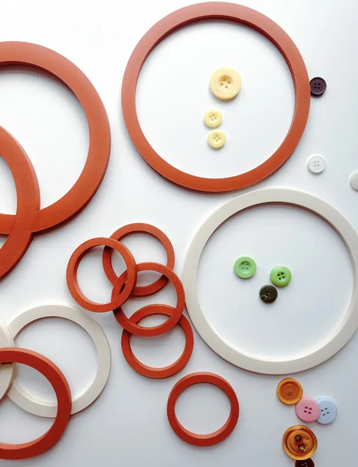 Terracotta and cream 3D printed Learning Circles with buttons